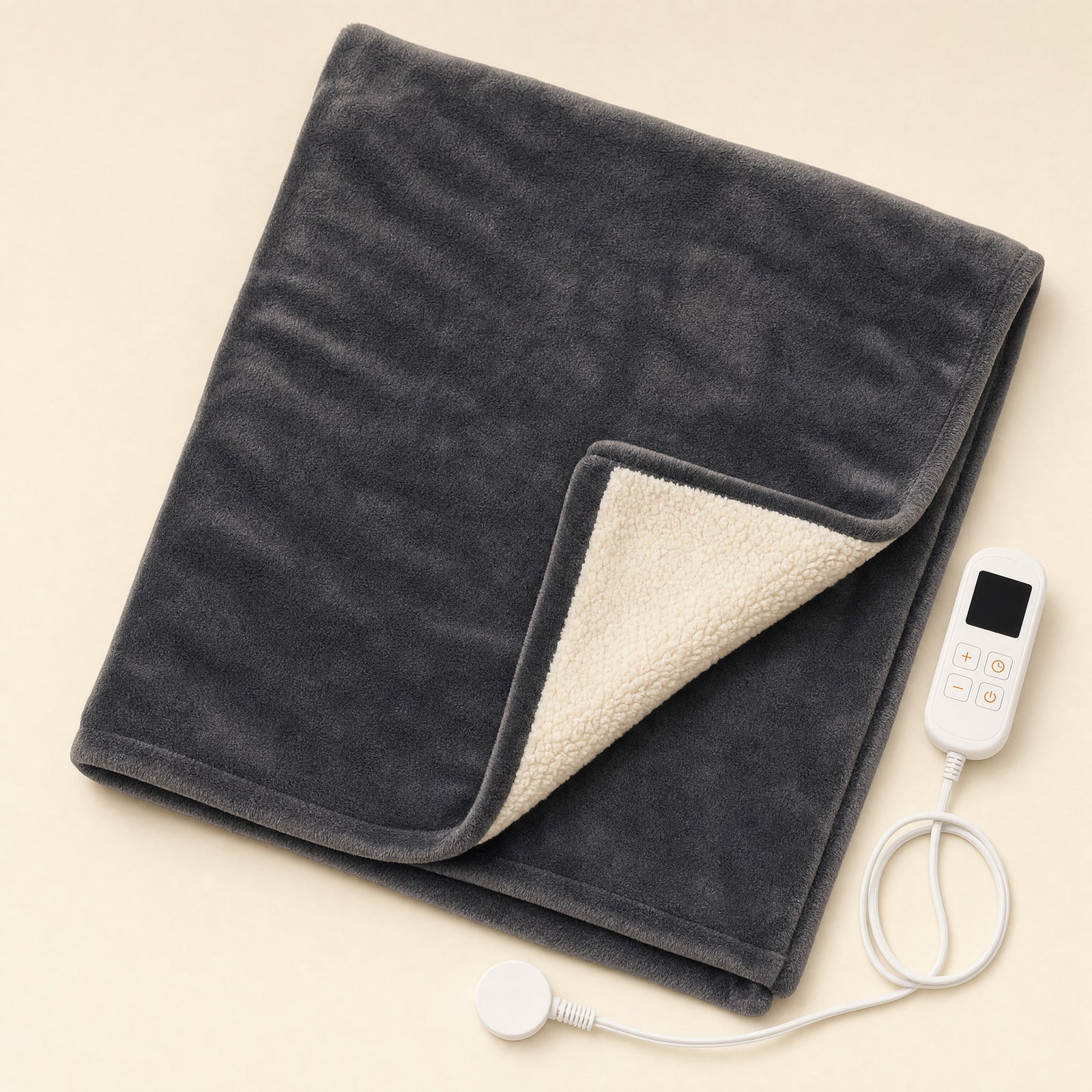 Wattlefold Rowan Heated Throw folded, charcoal flannel with cream sherpa reverse and detachable controller
